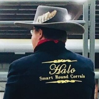 Rear view of man with a gray cowboy hat and an embroidered jacket
